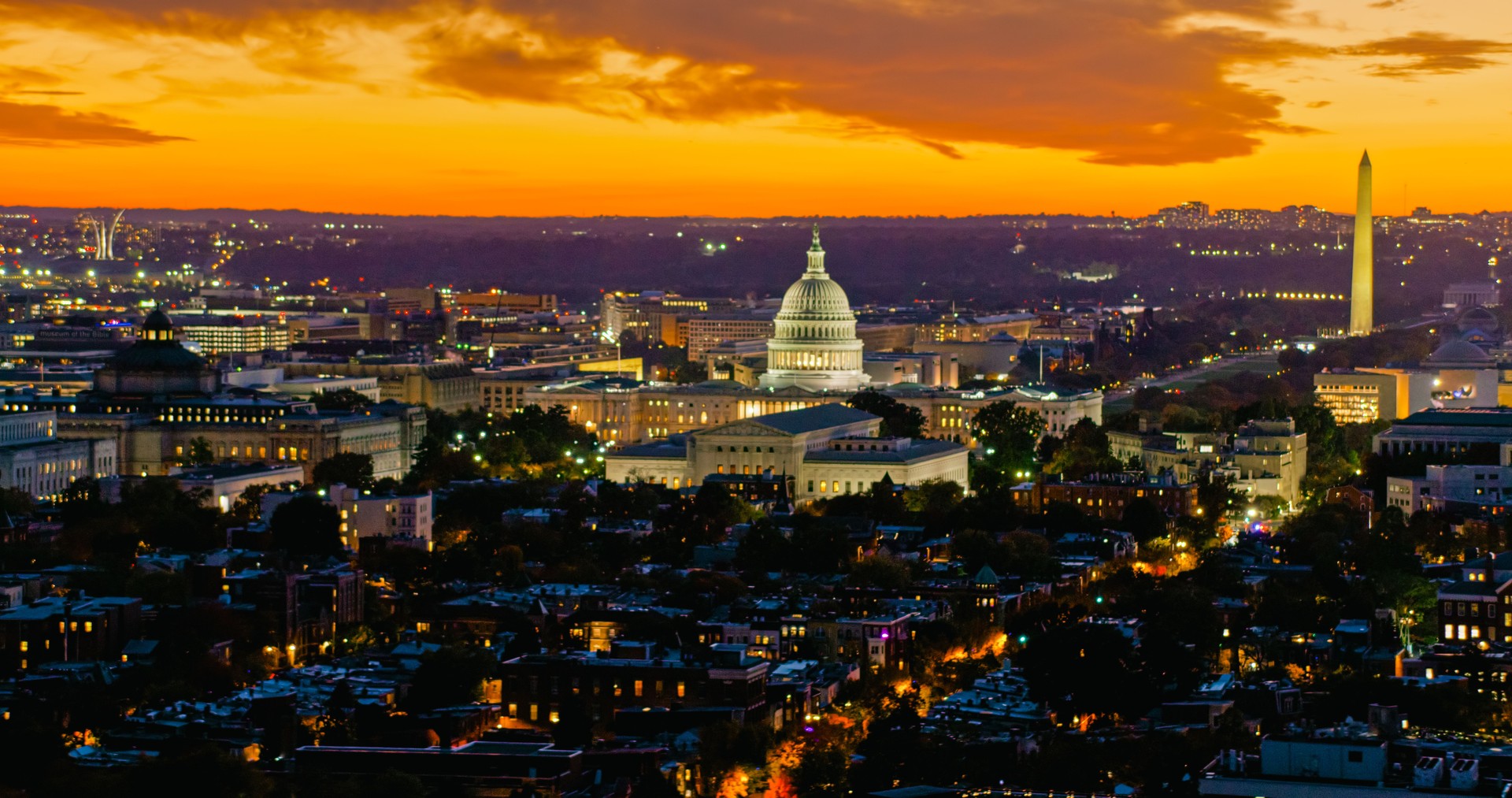 Fiery Orange Sky Behind United States Supreme Court and Capitol Building and the Washington Monument at Dusk